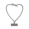 Silver BlingBling wristlet strap displayed on strap card with Tiny Bulb reflector ends