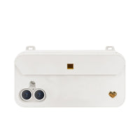 Minimalist white iPhone 16 case with dual strap-ready ears and charm holes