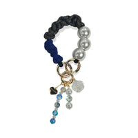 Hades handle in hand-braided TENCEL™ hanging with charm details
