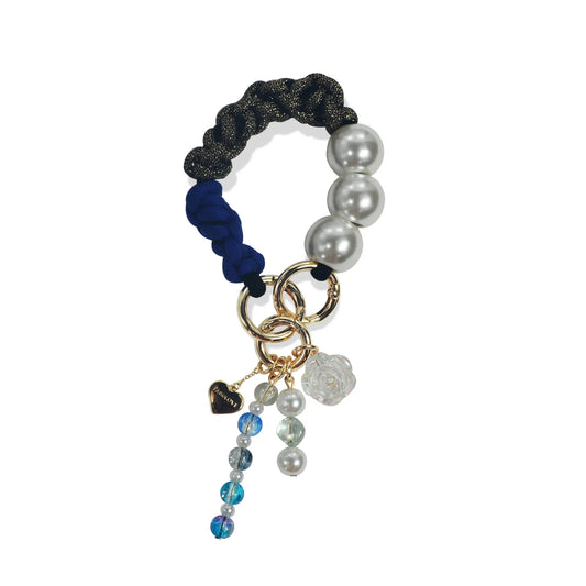 Hades handle in hand-braided TENCEL™ hanging with charm details