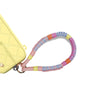 Eco-friendly phone strap in pastel dream color secured to charging port via strap card