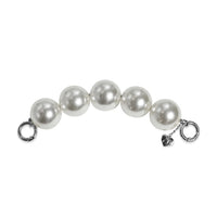 Side profile of pearl handle strap with silver clasps apart, easy to attach.