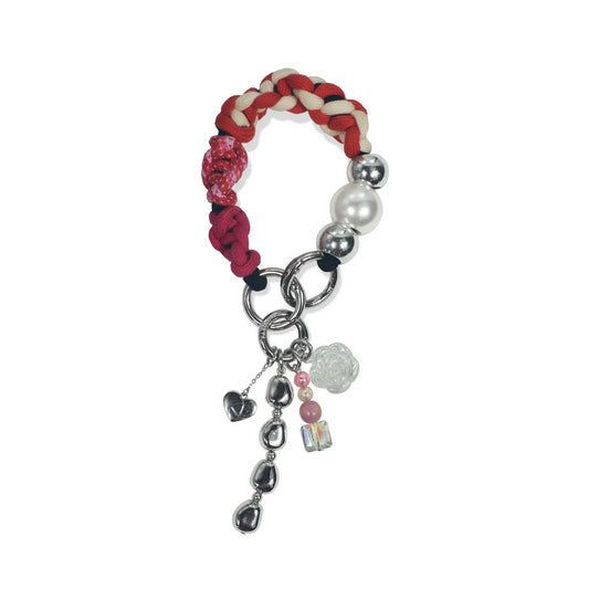 Hand-braided TENCEL™ handle in Rhea hanging with charm elements